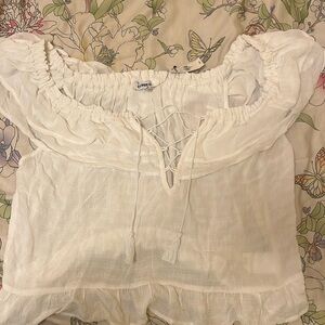 A white blouse from express NEW never worn with tag. Size XL Made out of rayon